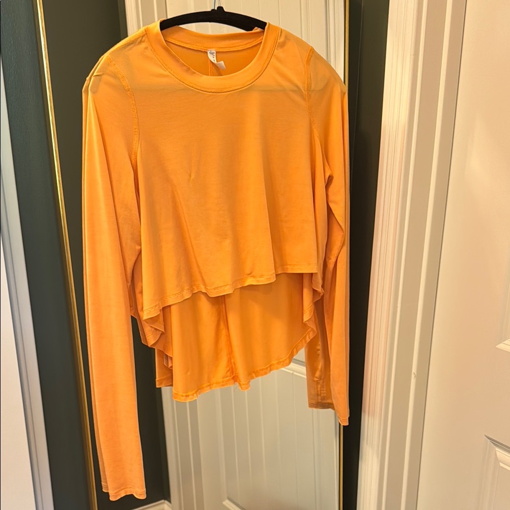 FP Movement by Free People Asymmetrical Long Sleeve Tee in Orange
